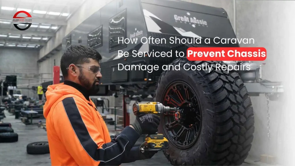 Technician performing caravan wheel and chassis inspection to prevent damage and costly repairs